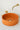 Vasque ronde en béton de couleur terre cuite orange