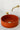 vasque en béton rouge, forme cylindrique ronde